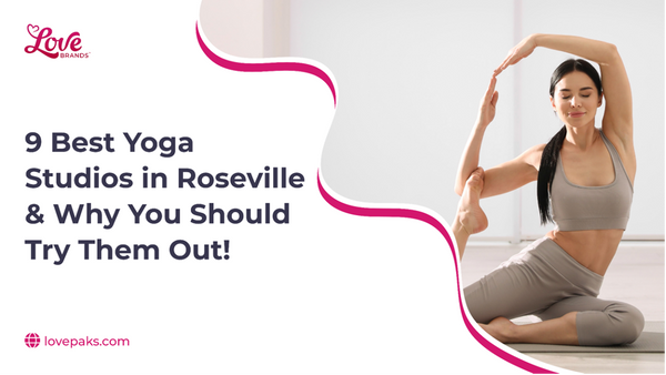 Woman in beige activewear seated on the floor, drawing one leg up behind her head in a side stretch