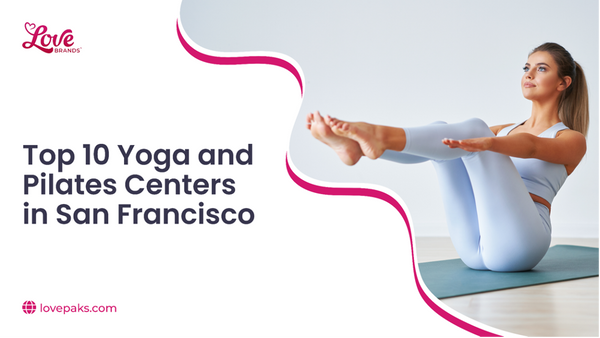Woman in pale blue activewear balancing in a boat pose on a yoga mat
