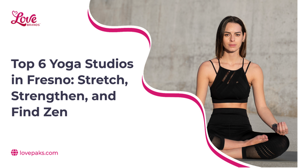 Woman in black activewear meditating cross-legged in front of a concrete wall